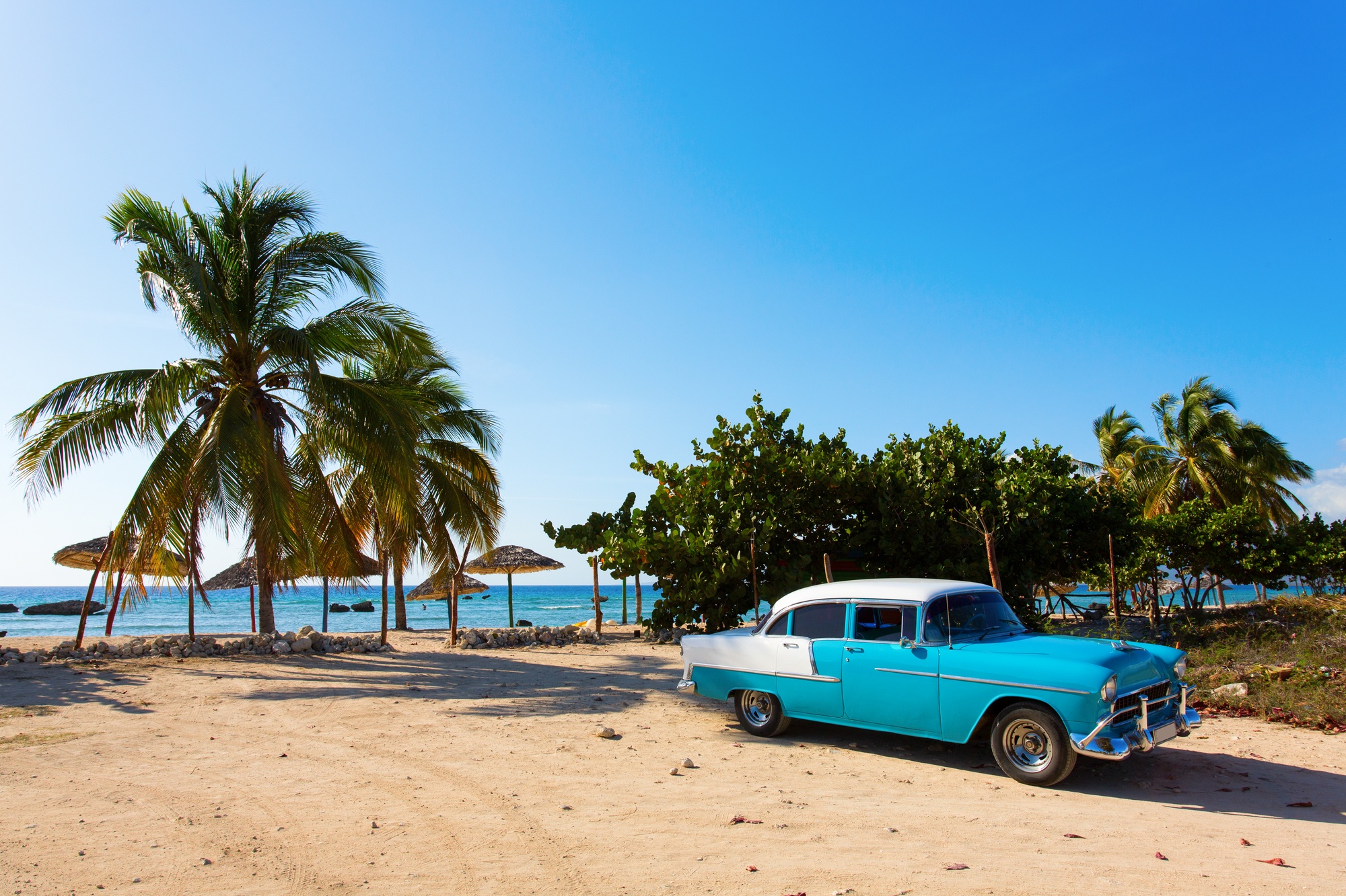 Old classic car on a beach in Cuba