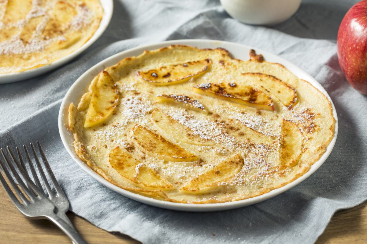 Homemade apple Dutch pancake with powdered suga