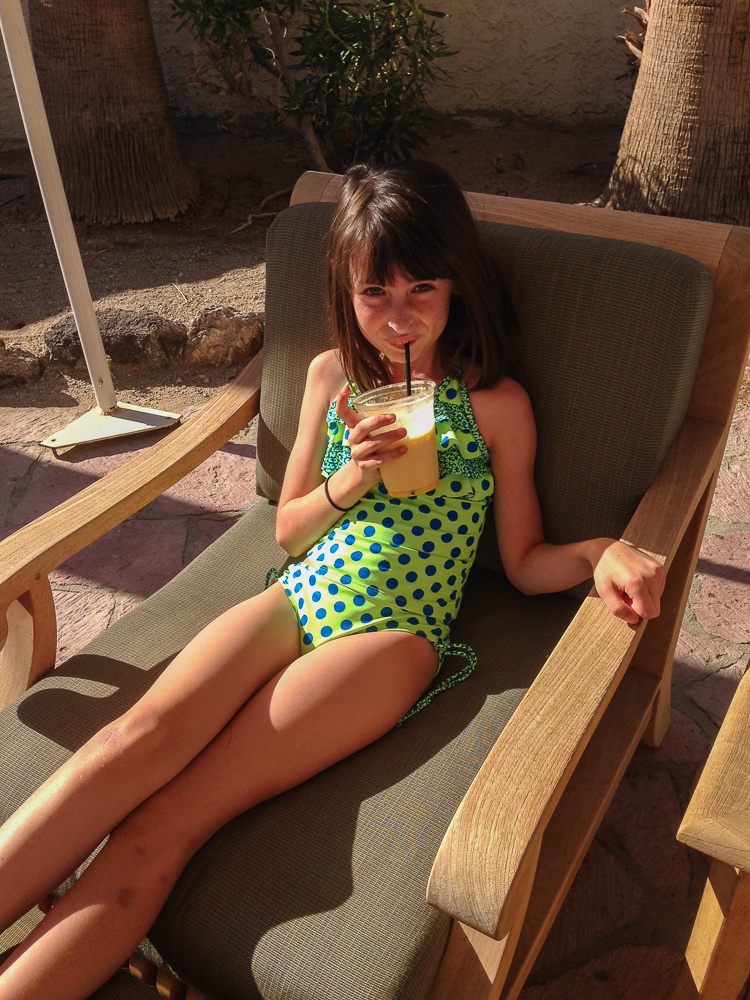 Tween with smoothie by pool at La Casa Del Zorro