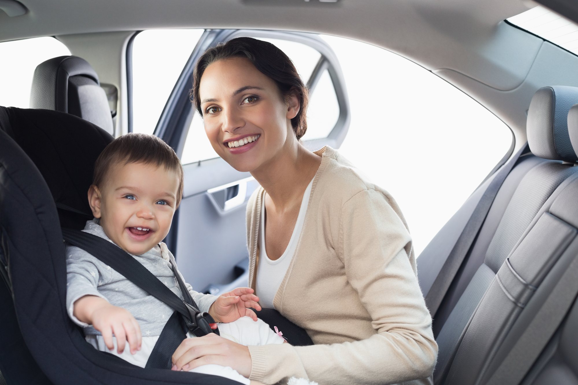 Happy mom and baby on road trip