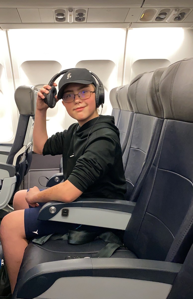 Tween watching movie on a long airplane flight