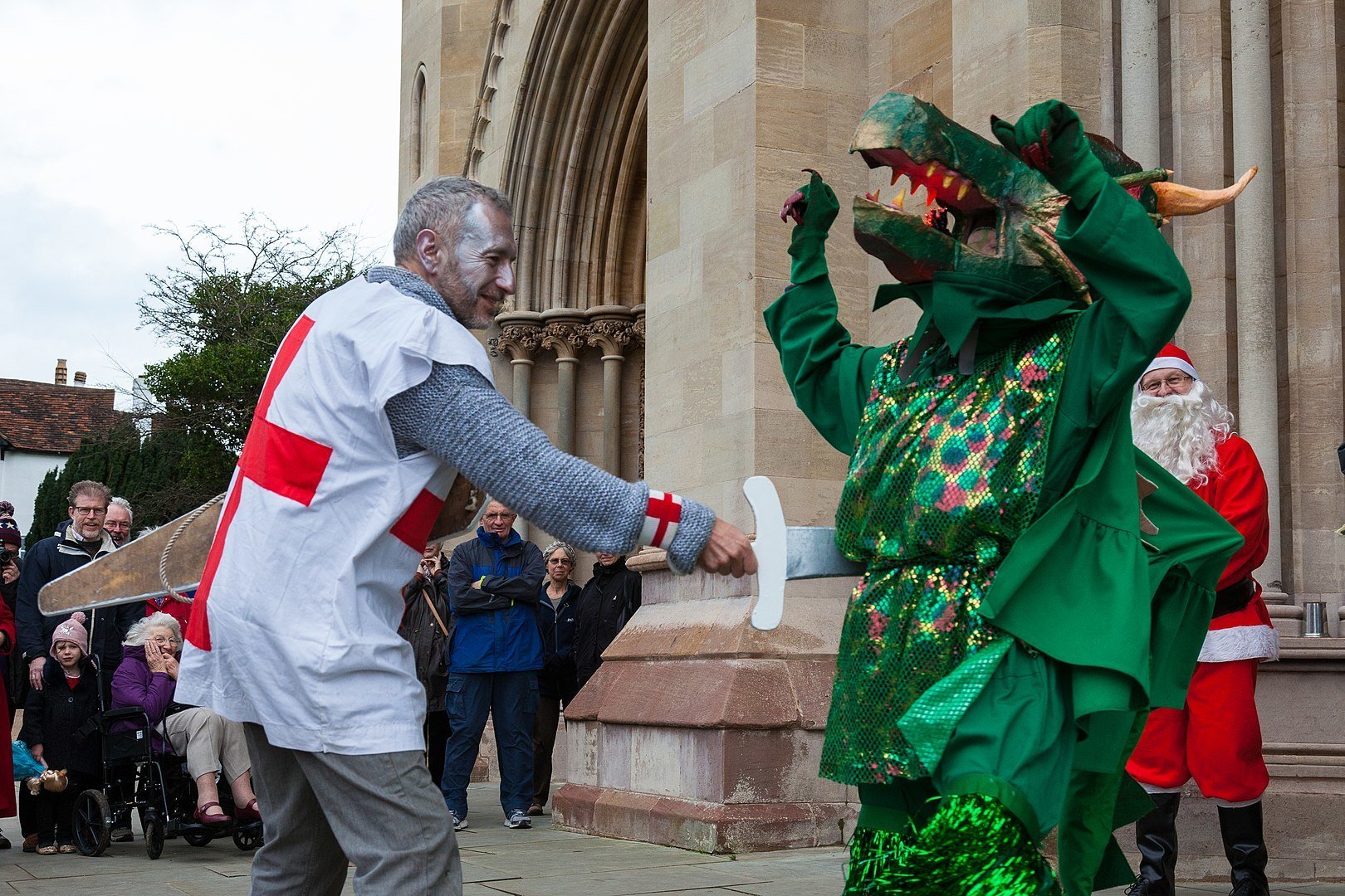 Saint George kills the dragon in a mummers' play in Great Britain 