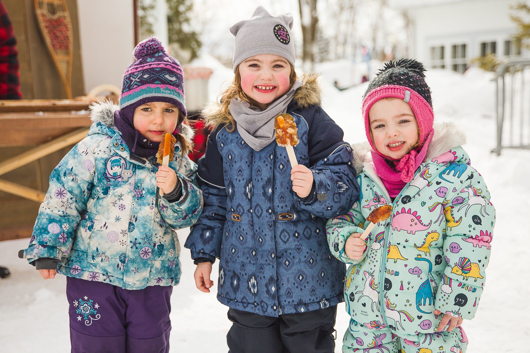 Kids enjoying maple taffy at the Quebec Winter Carnival