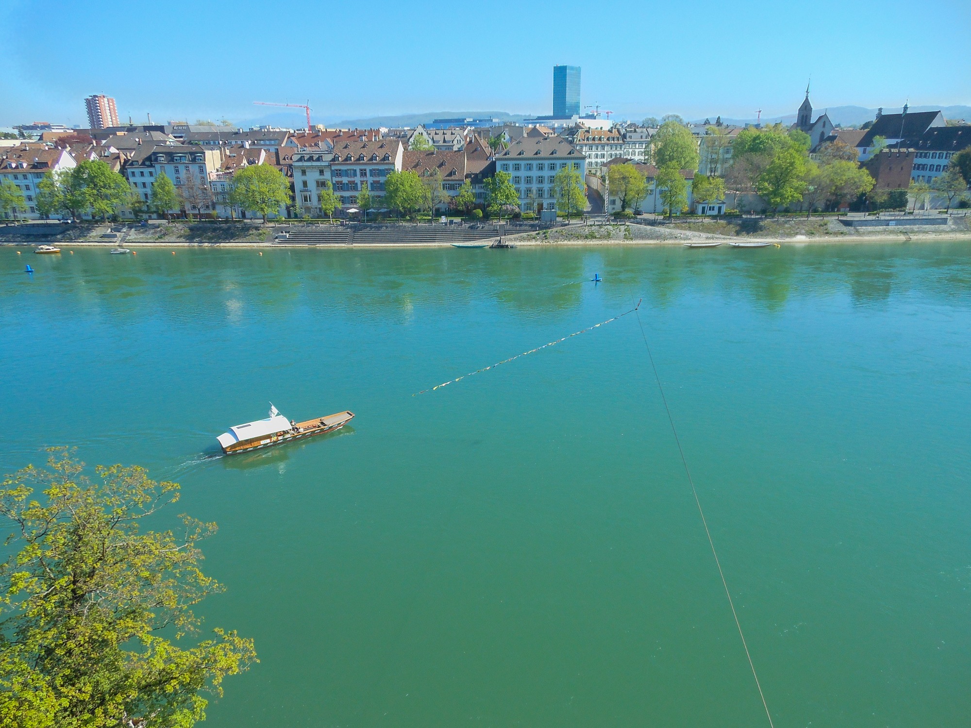 A non-motorized ferry crossing the Rhine River in Basel, Switzerland