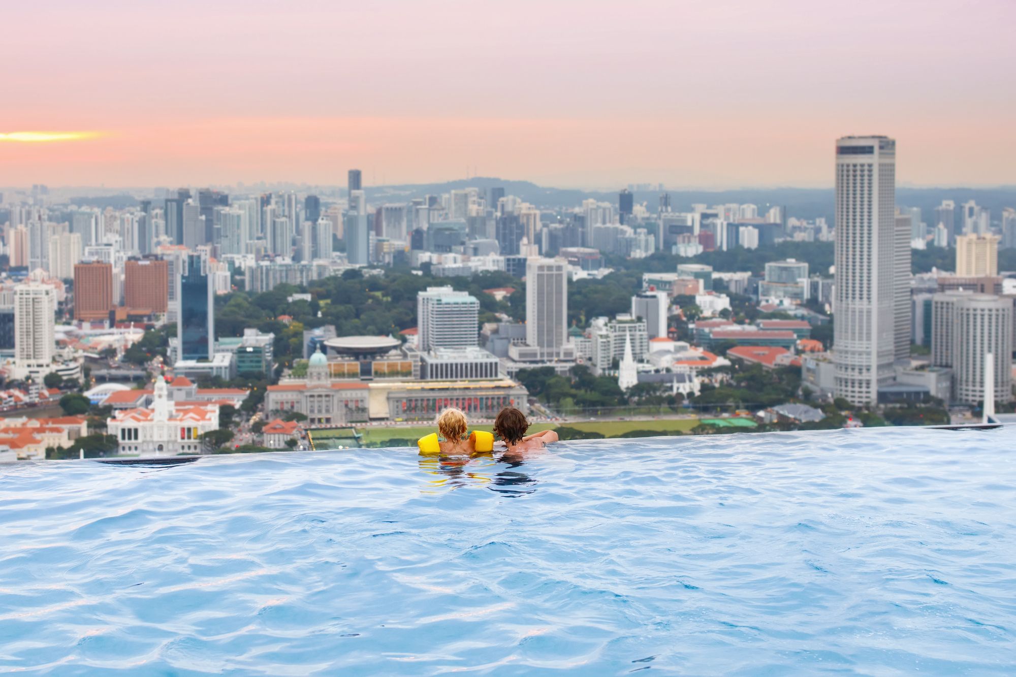 Kids swimming in the Marina Bay Sands Hotel pool on a Singapore family vacation