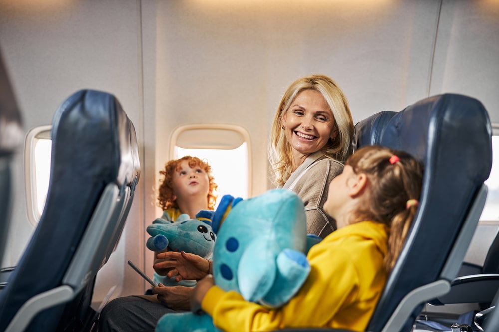 Mom and children on an airplane