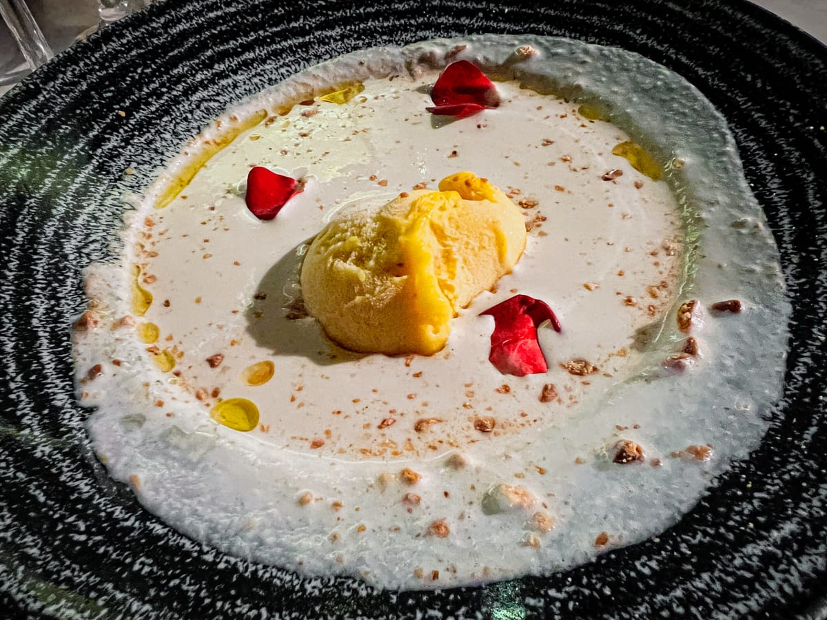 Ajo Blanco soup served with mango sorbet at El Pimpi Restaurant in Malaga