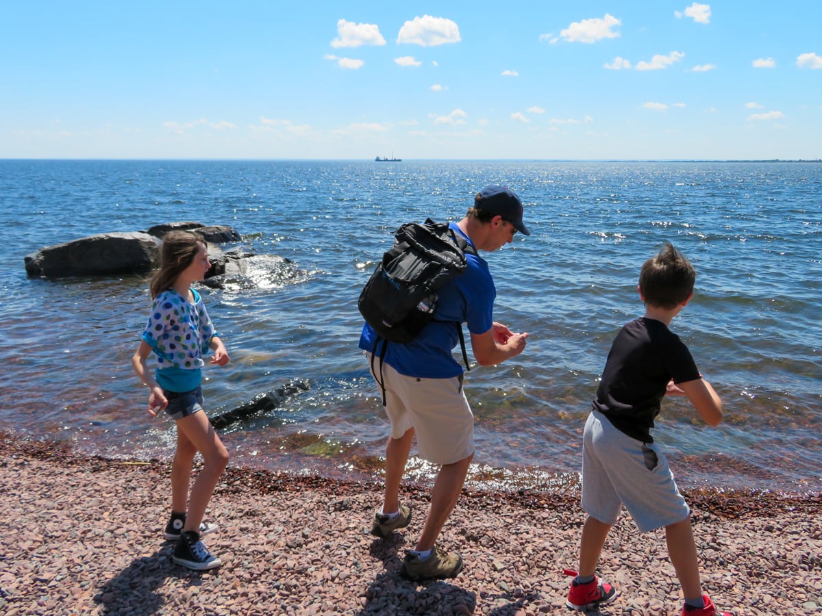 Skipping rocks at Lake Superior in Duluth with kids