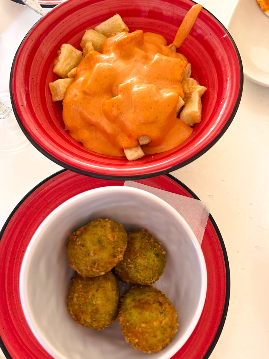 Patatas Bravas and zucchini croquettes in Spain