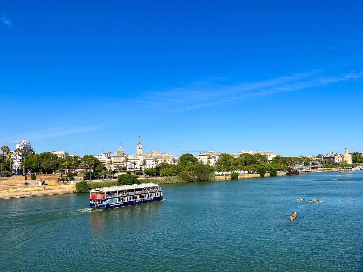 Riverboat and kayaks on the Guadalquivir River 