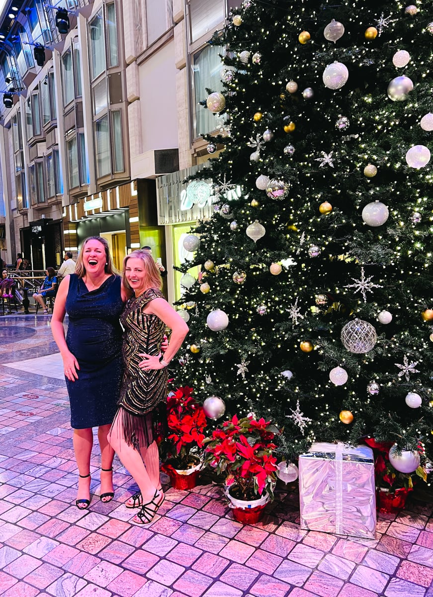 Friends laughing on a Royal Caribbean Christmas cruise