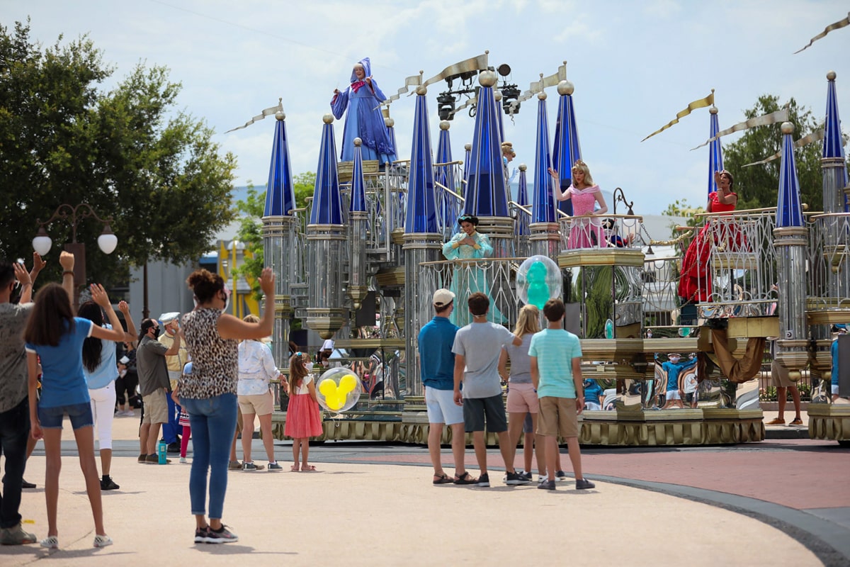 Teens watching a parade at Magic Kingdom 