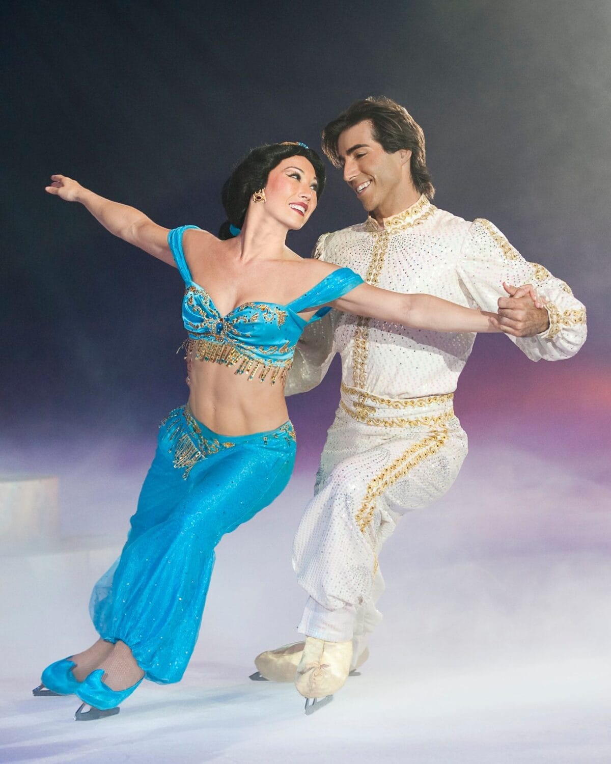 Disney characters Jasmine and Aladdin ice skating in Disney on Ice  