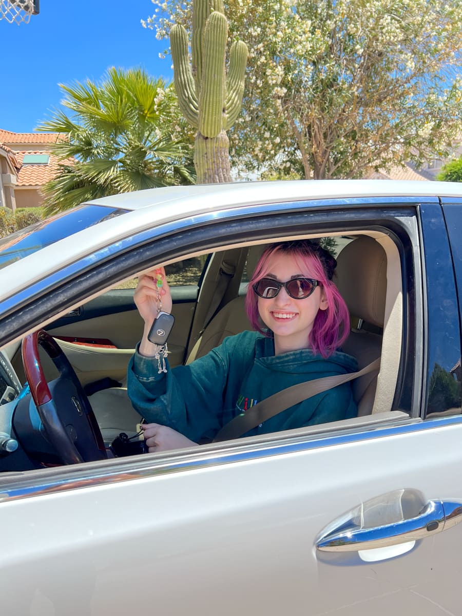 Teenage girl driving a car