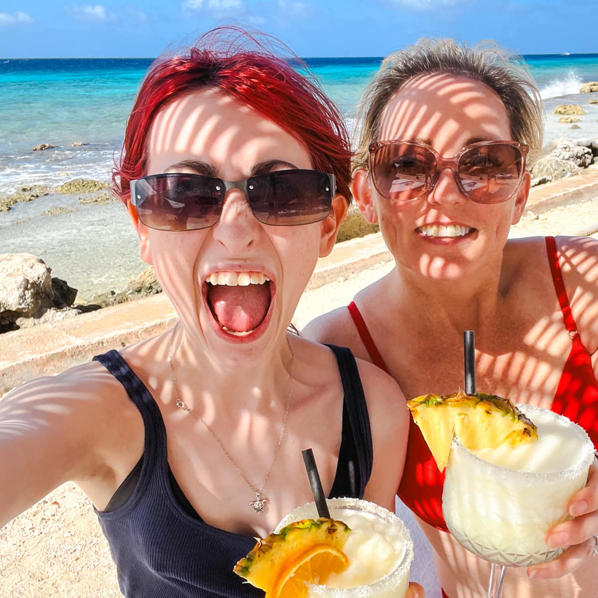 Mom and daughter on beach during cruise