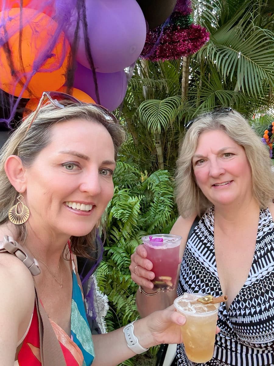 Travels Between With Colleen and sister with cocktails at Velas Vallarta