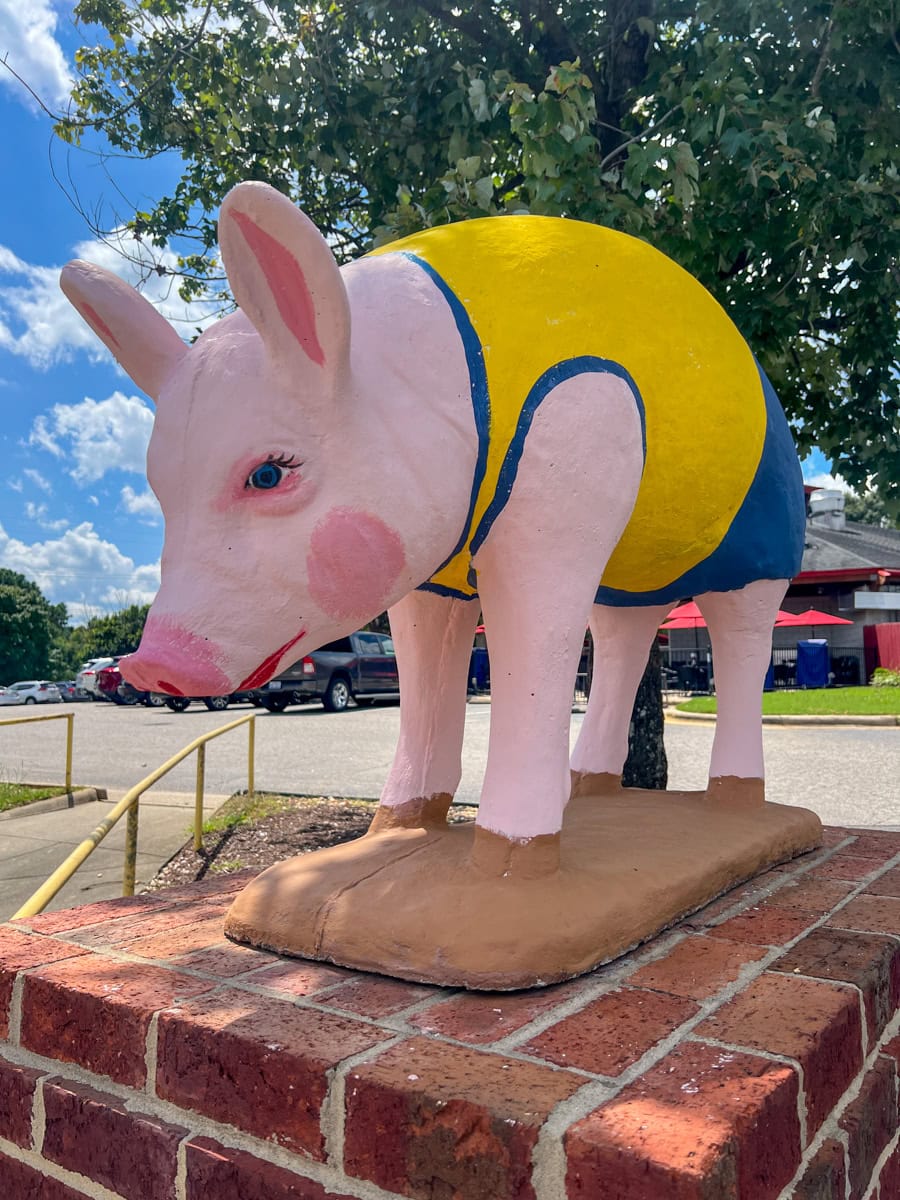 Look for piggy statues near State Farmers Market Restaurant