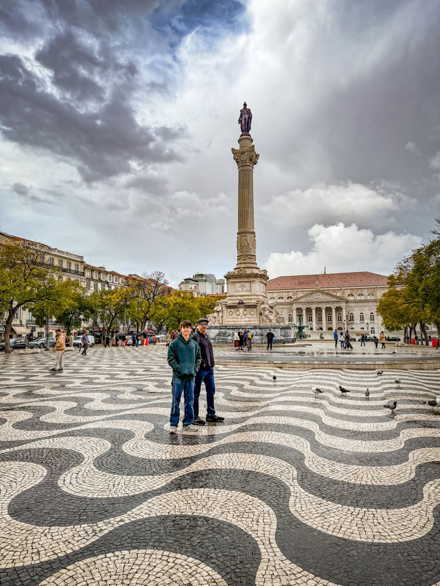 Teenager and dad in Rossio Square in Lisbon