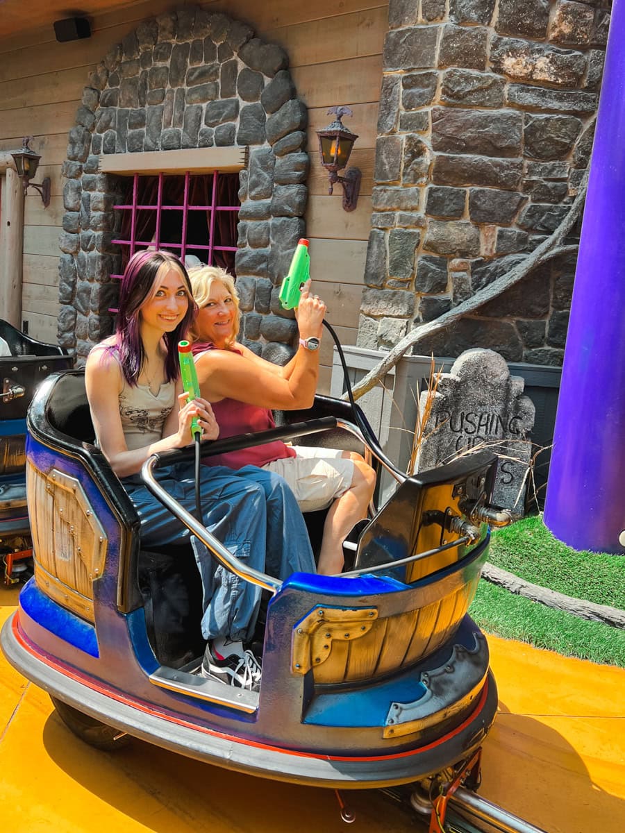 Teen and adult on Ghost Blasters at Nickelodeon Universe 