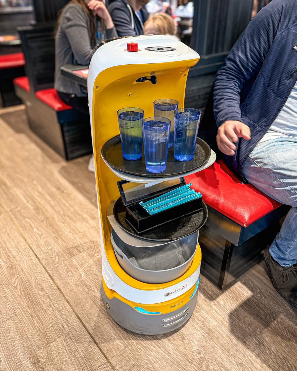 A robot delivering drinks at Kura Sushi
