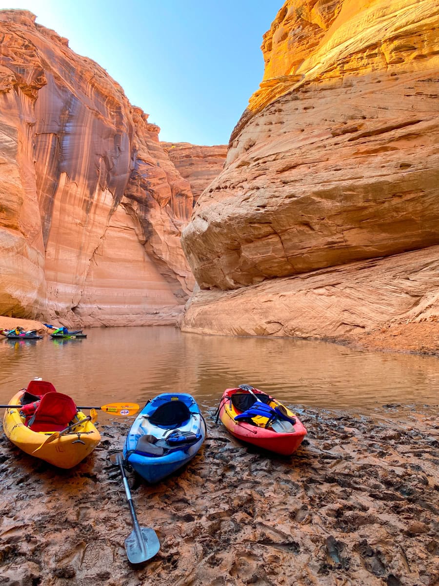 Kayaks along the shore of Lake Powell, at an entrance to Antelope Canyon